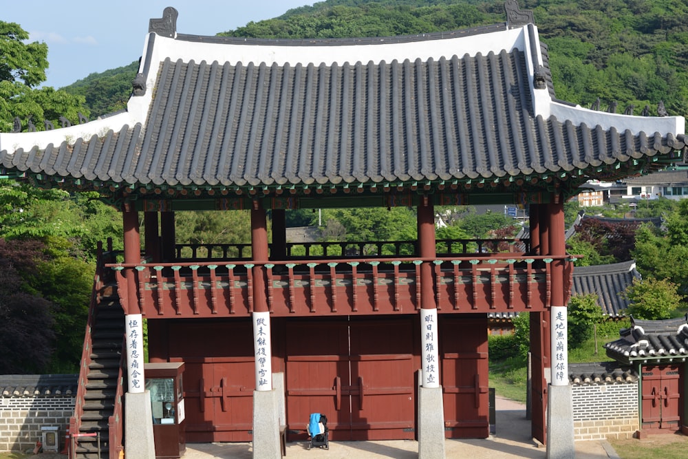 a tall red building with a tall roof