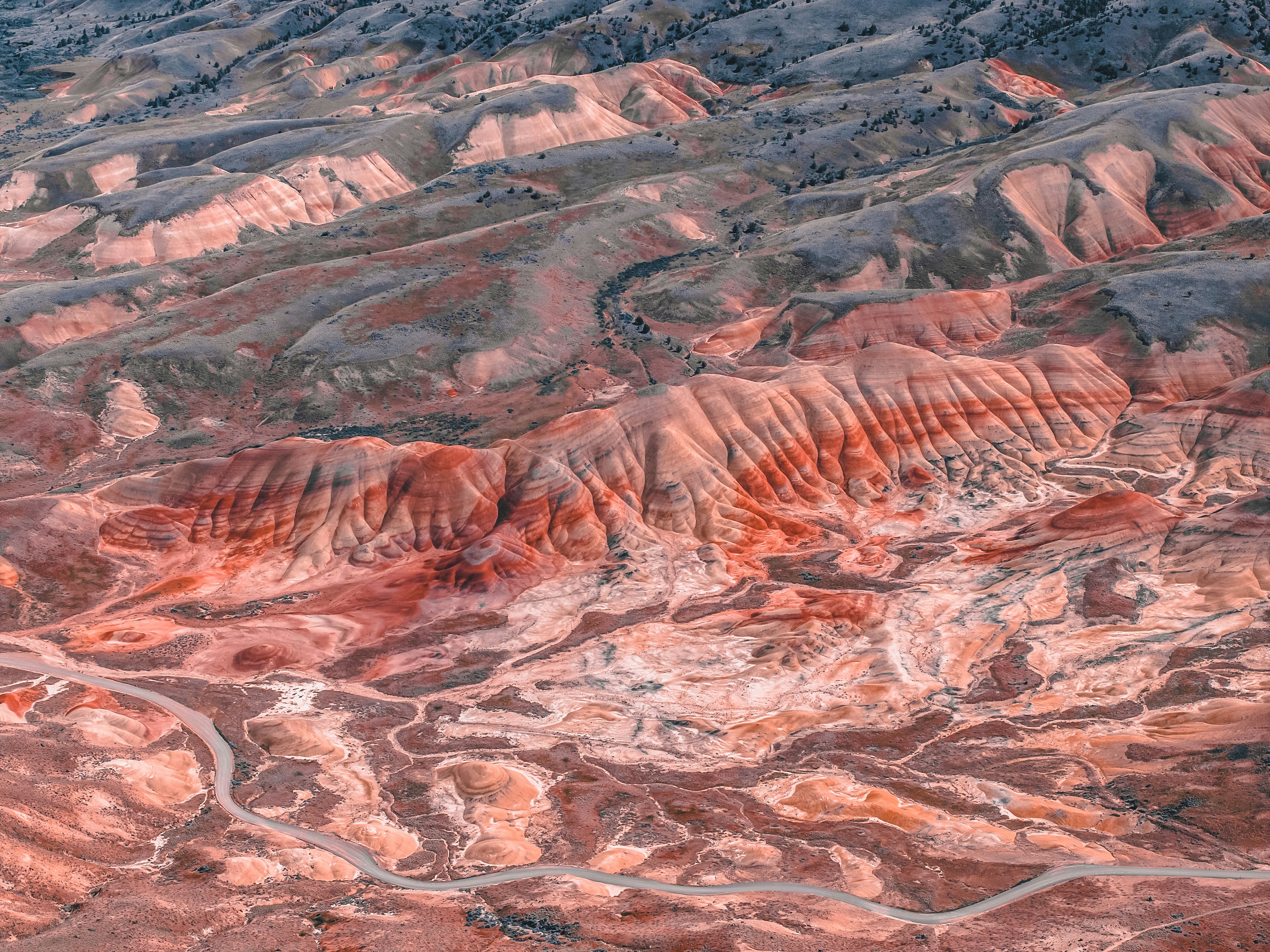an aerial view of a mountain range with a river running through it