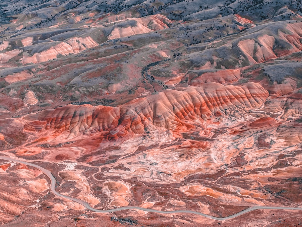 an aerial view of a mountain range with a river running through it