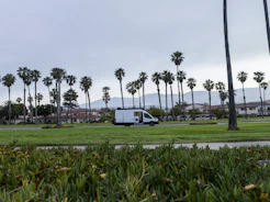 Prime Pest Control van parked outside a sunny Sebring neighborhood.