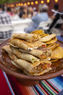 a plate full of quesadillas sitting on a table