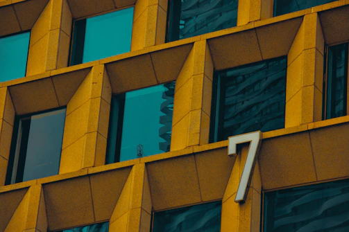 Close-up of a building facade with highlighted inspection points in golden circles.