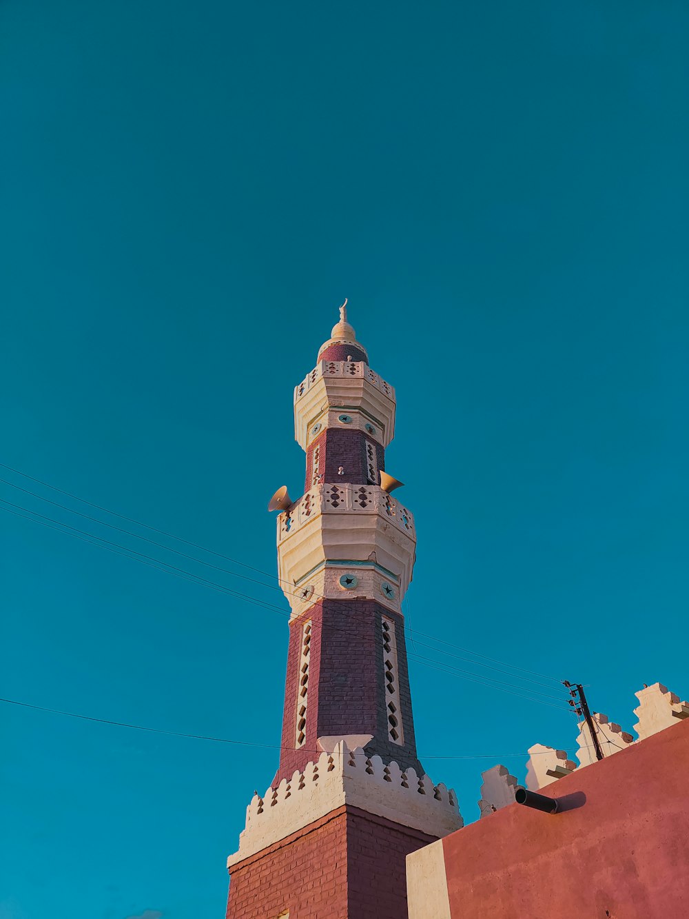 a tall tower with a clock on the top of it