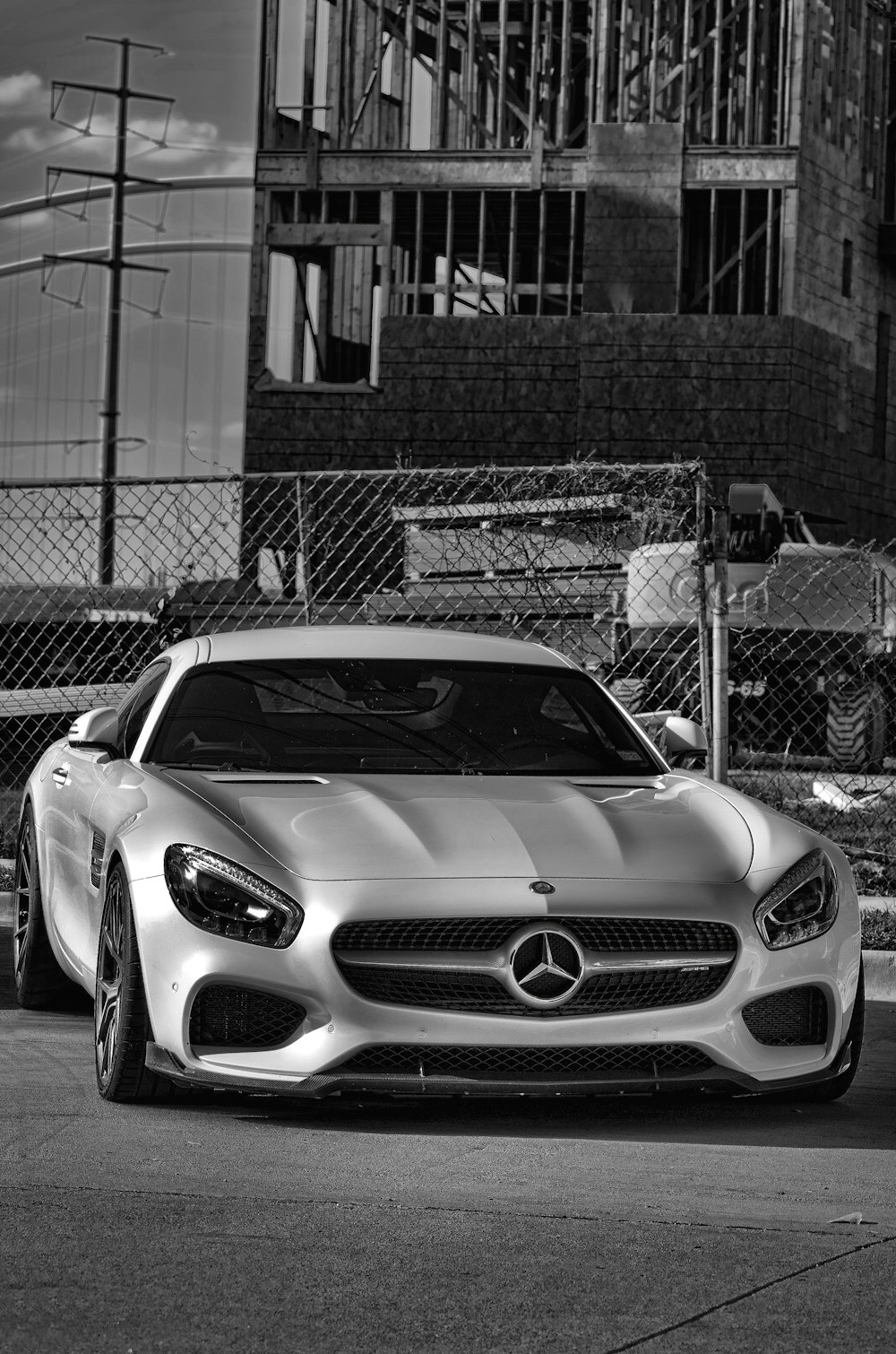 a mercedes sports car parked in front of a building