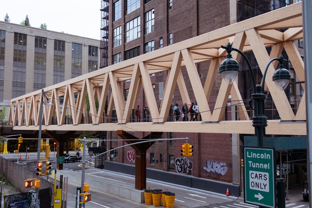 a pedestrian bridge over a city street