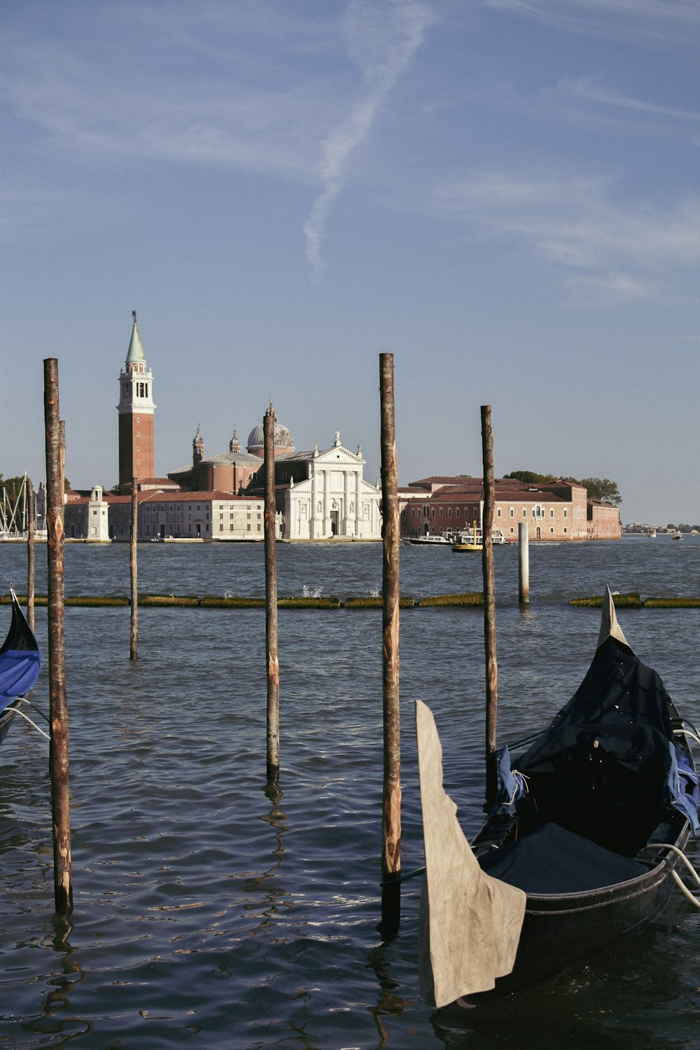 a couple of gondolas that are sitting in the water