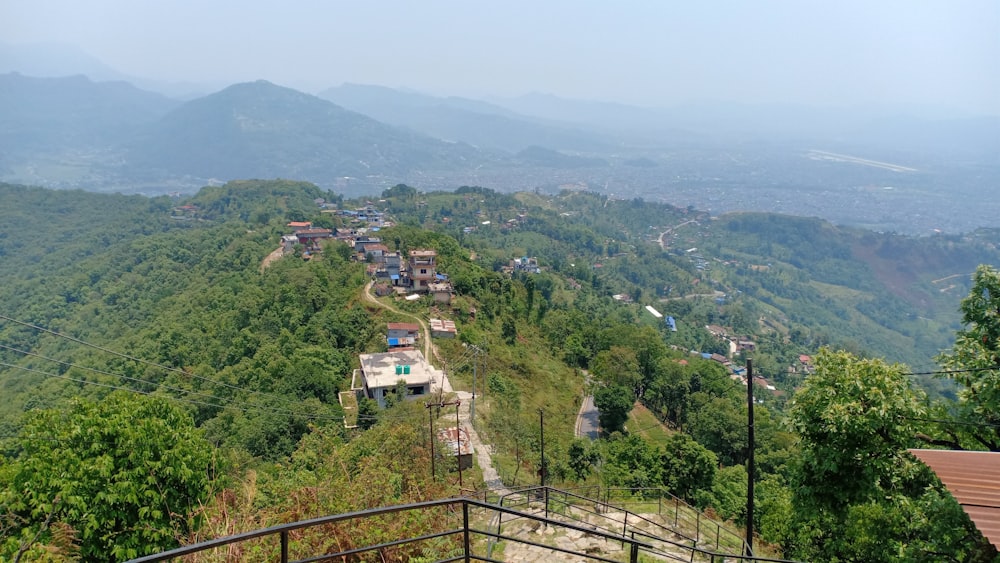 a scenic view of a village on a mountain