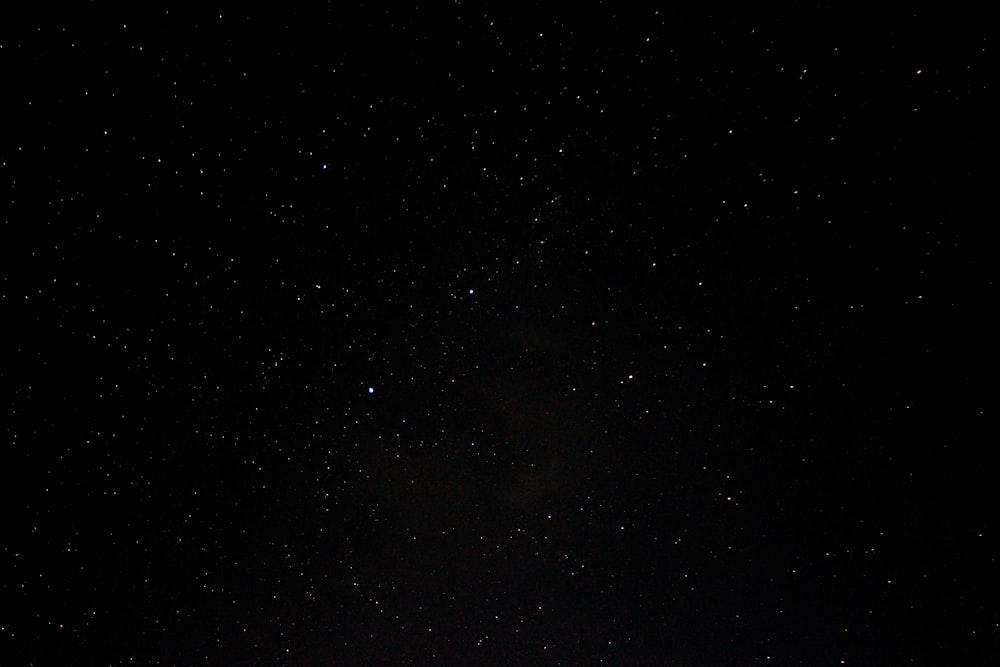 a night sky with a few stars in it