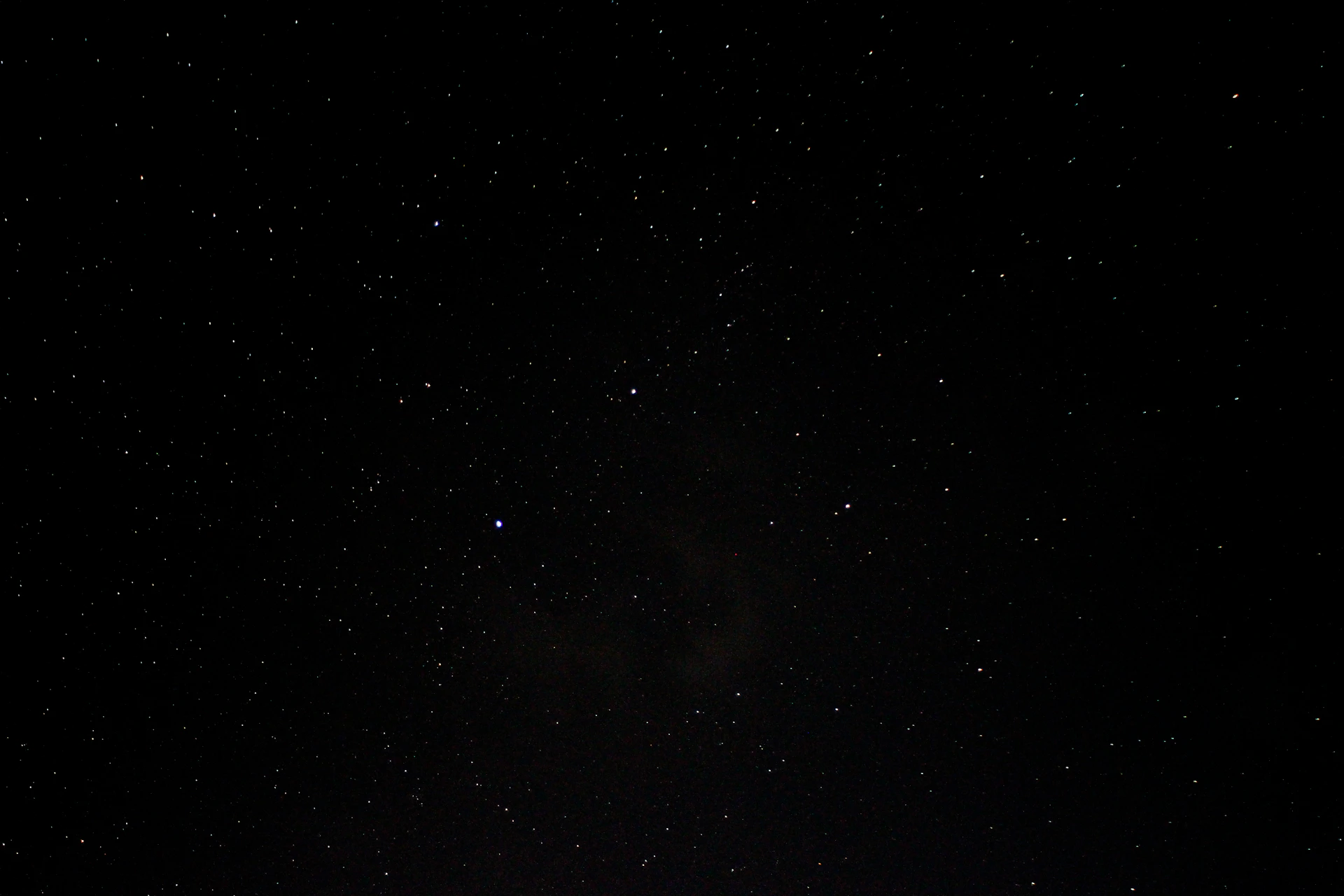 a night sky with a few stars in it