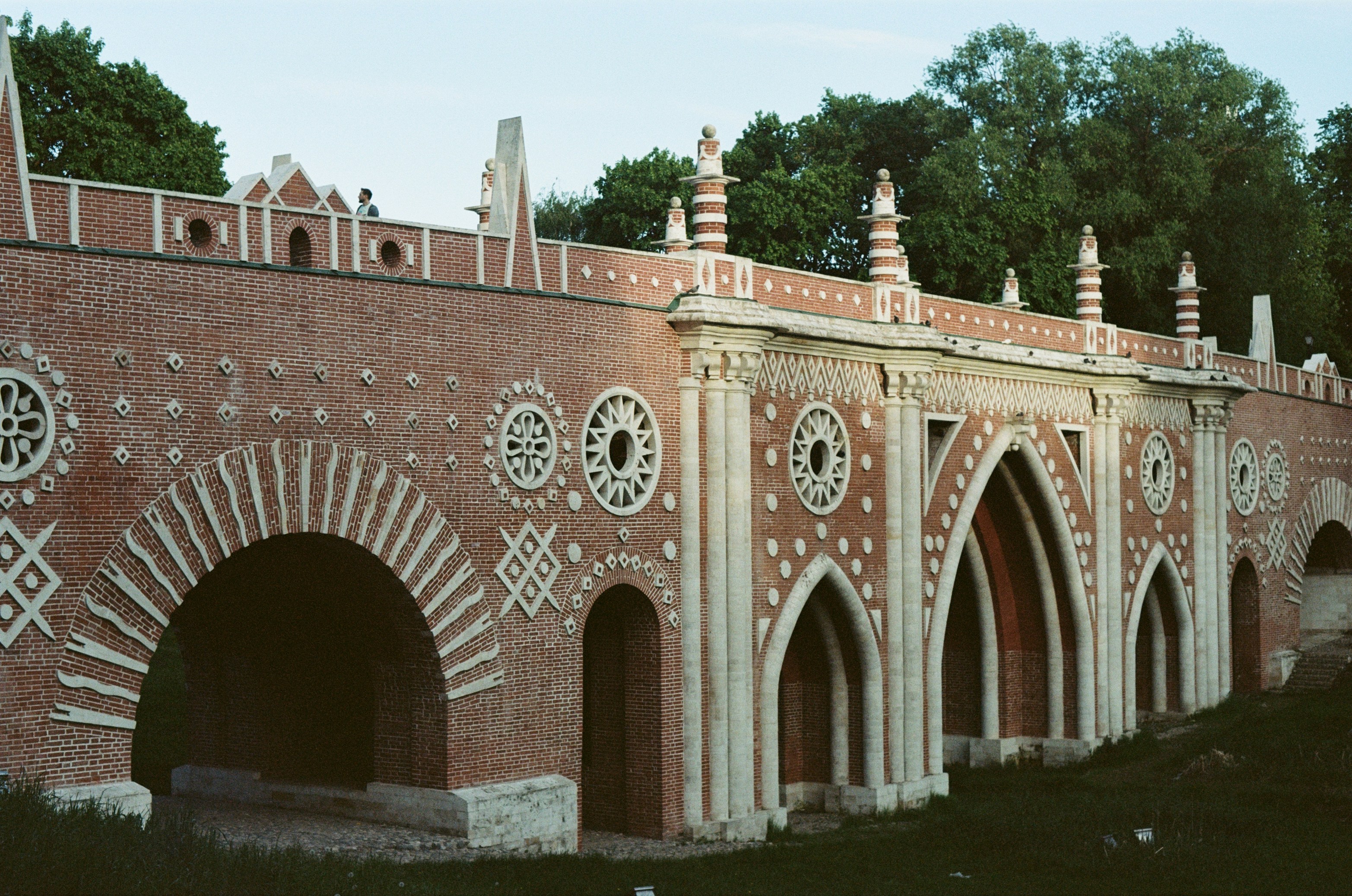a brick building with arched windows and arches