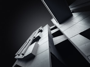 A detailed 3D rendering of a modern architectural project with sharp angles.