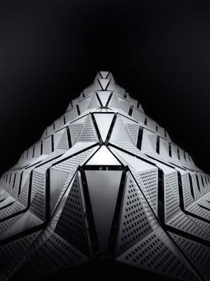 Artistic 3D model of a futuristic architectural concept with dynamic shapes.