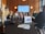 Close-up of a business meeting with charts and digital devices on the table.