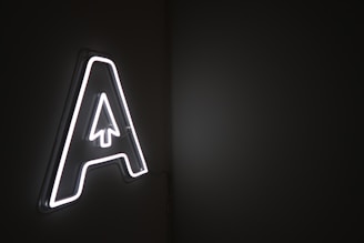 A neon sign representing Assassins over Agencies concept.