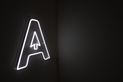 A neon sign representing Assassins over Agencies concept.