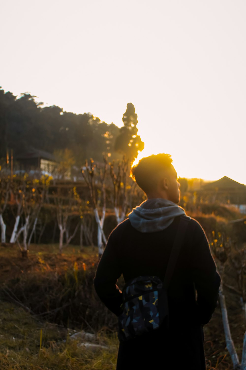 a person standing in a field with a frisbee