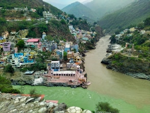 a river flowing through a lush green valley