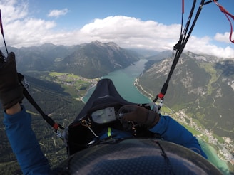 A scenic view of paragliding over the hills.