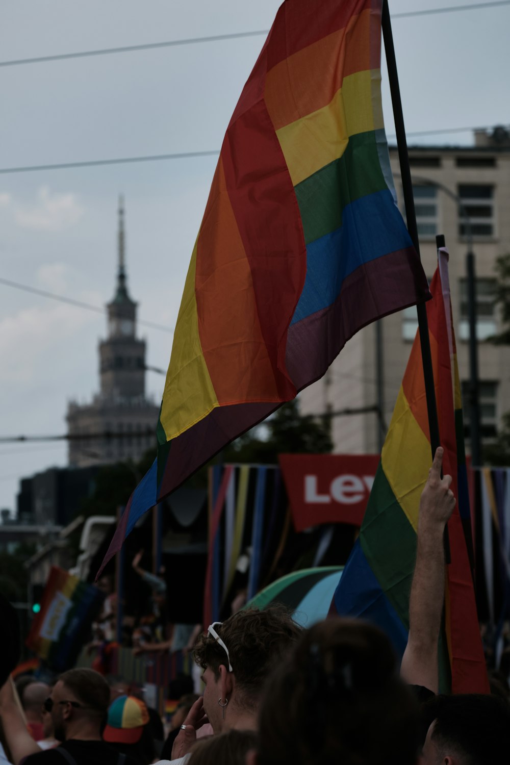 a group of people holding a rainbow flag