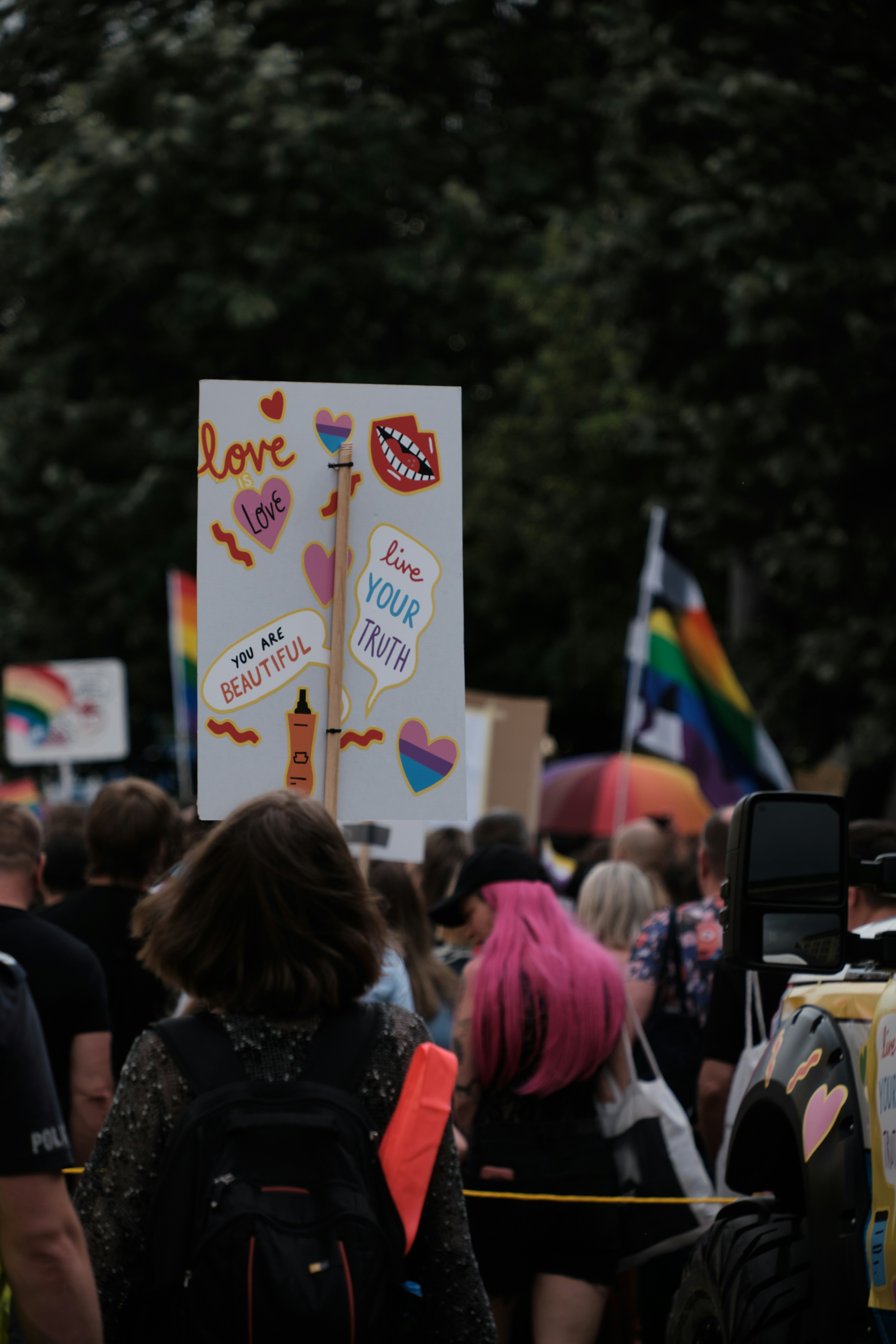 a crowd of people walking down a street