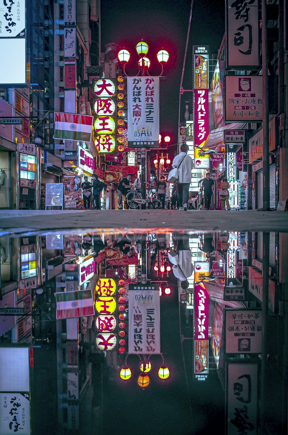 a city street filled with lots of neon signs