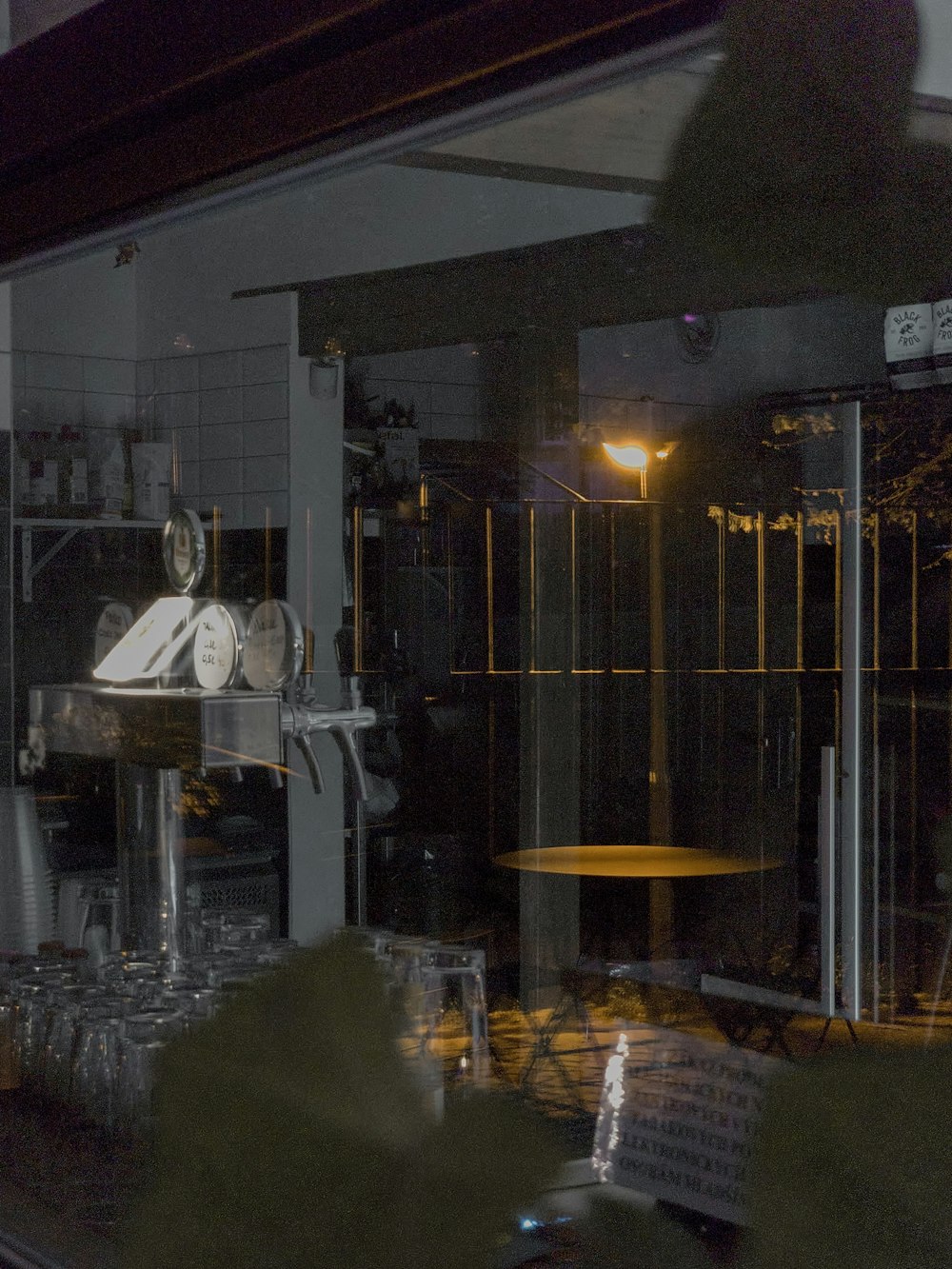 a window with a clock and a table in front of it