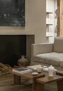 A cozy living room featuring a rustic wooden coffee table made by Vireo Woodworks.