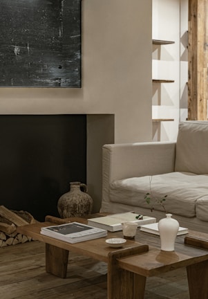 A cozy living room corner featuring textured throw pillows and a rustic wooden coffee table.