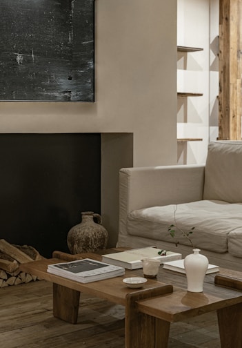 Cozy living room corner featuring a handcrafted wooden coffee table and soft cushions.