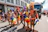 A lively group celebrating at a colorful Pride parade in Mexico City with festive decorations.