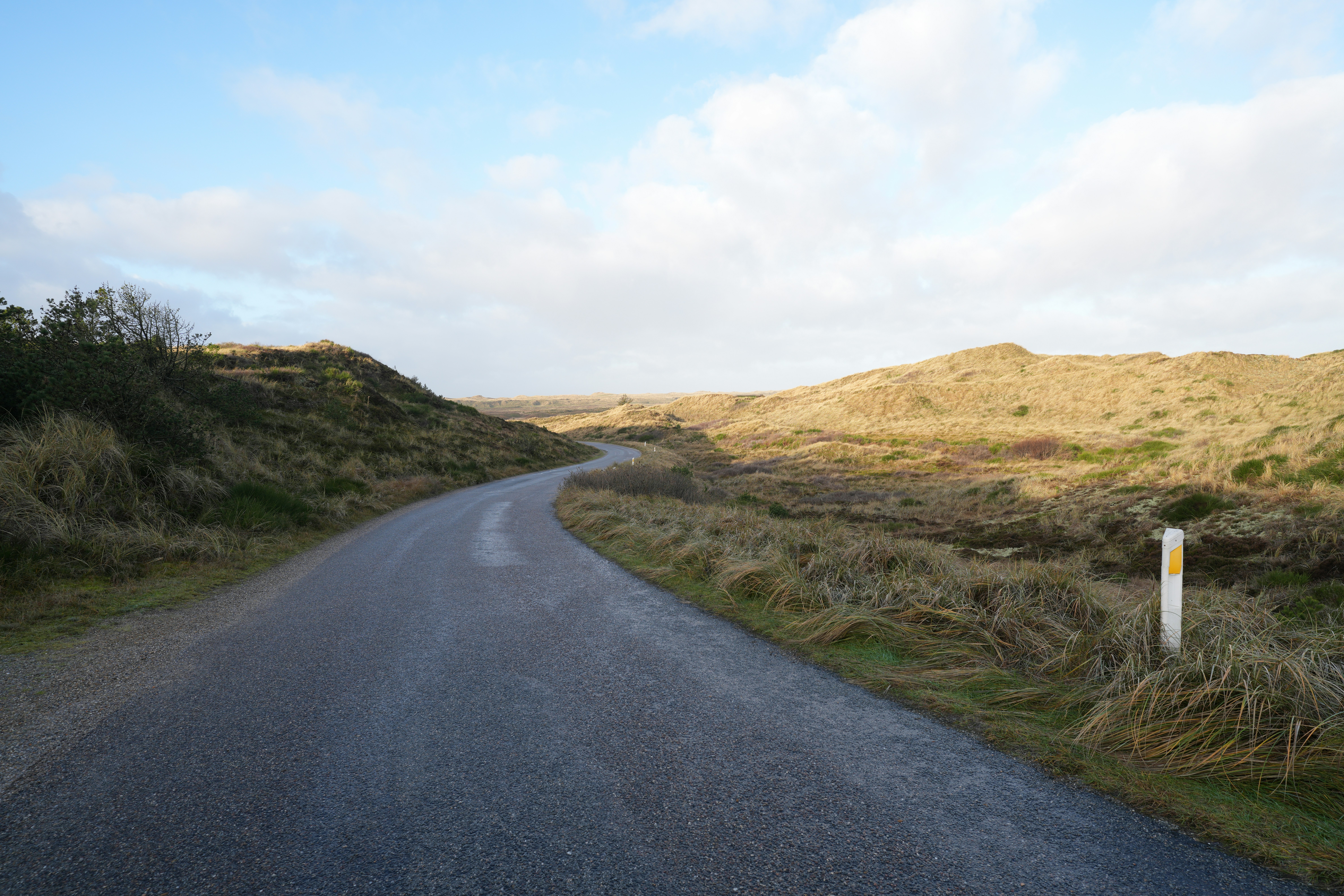 a road with a sign on the side of it