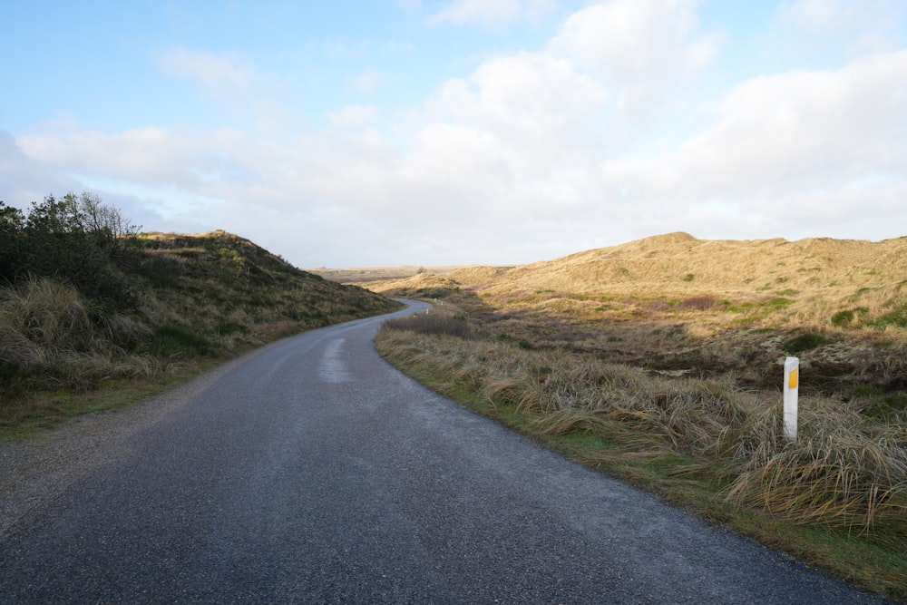 a road with a sign on the side of it