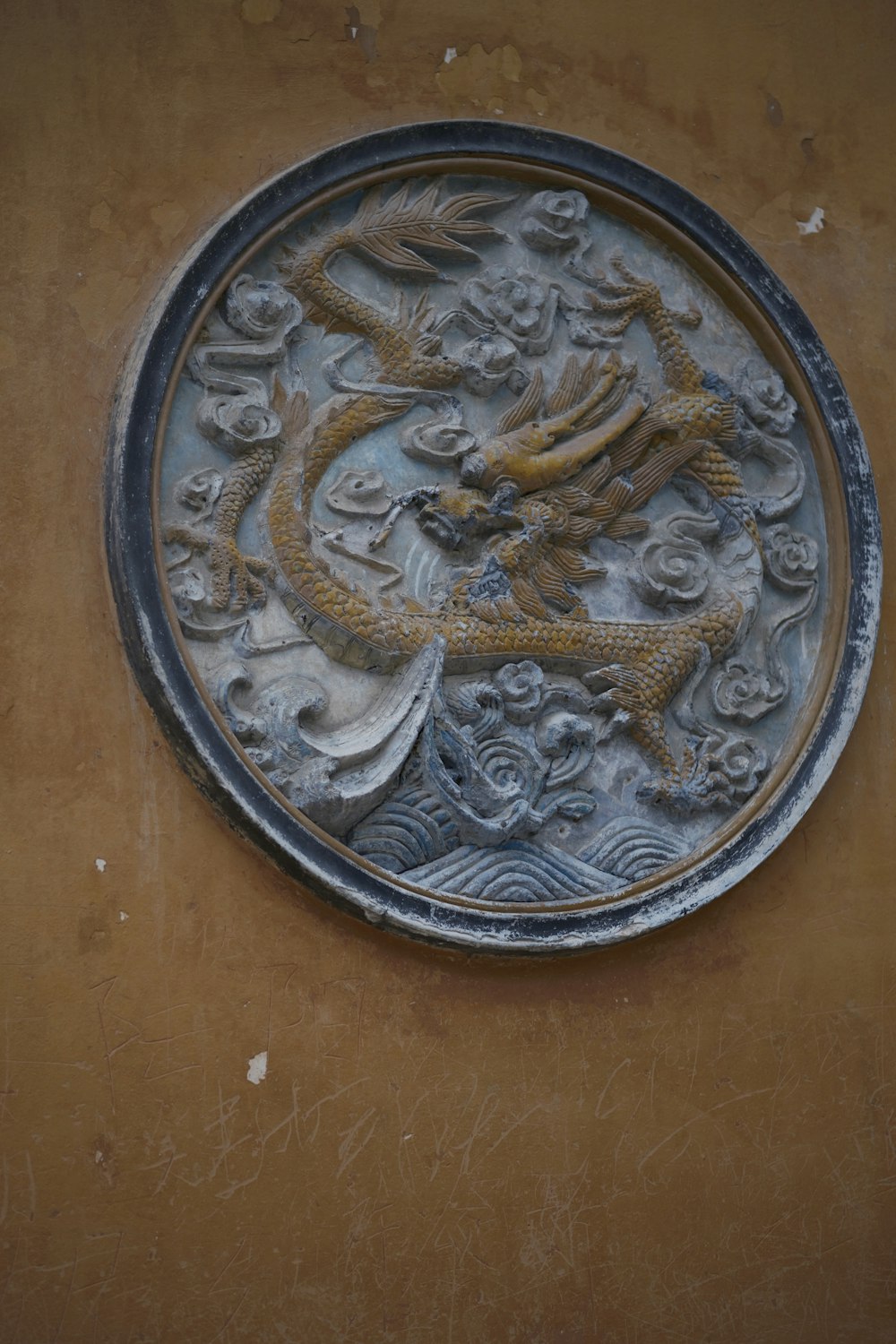 a metal plate with a dragon on it