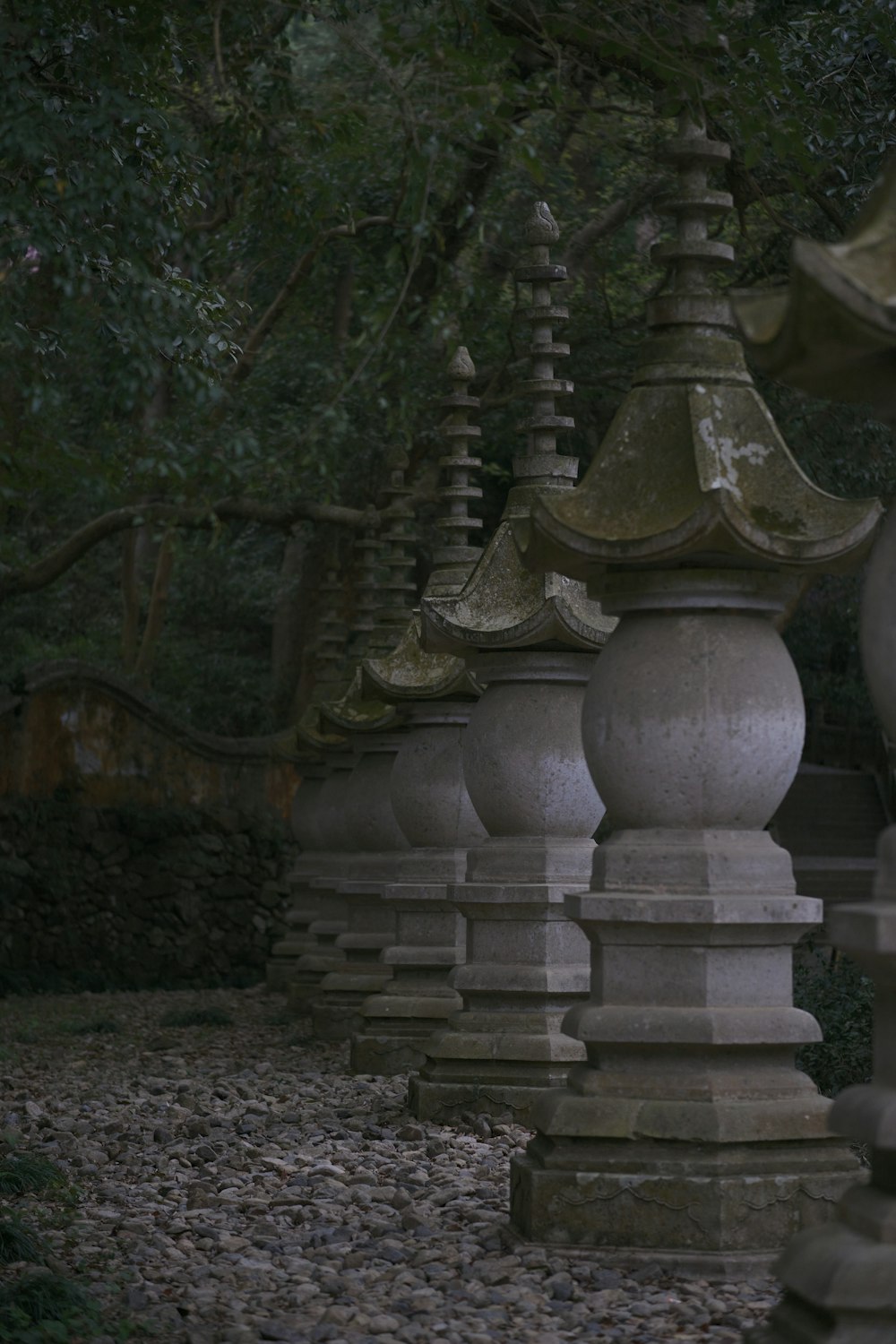 a row of stone lanterns sitting next to each other