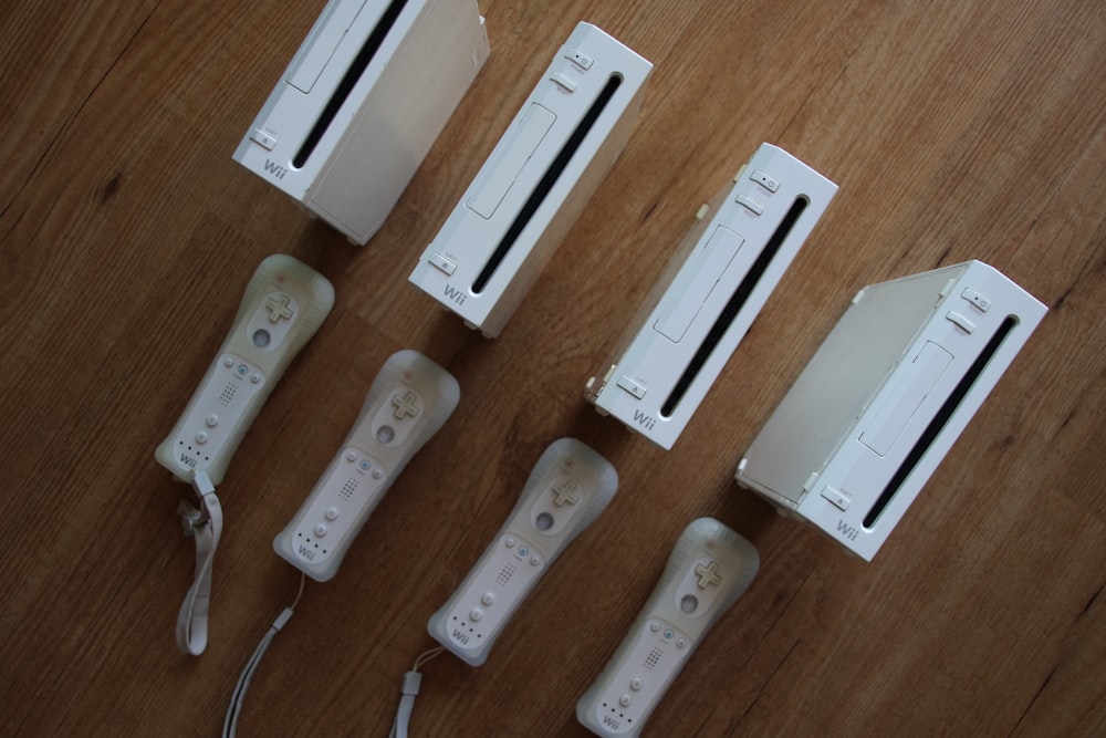 a group of four nintendo wii game controllers