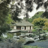 A serene Japanese-style home nestled by the sparkling waters of Sunshine Bay in Thailand.