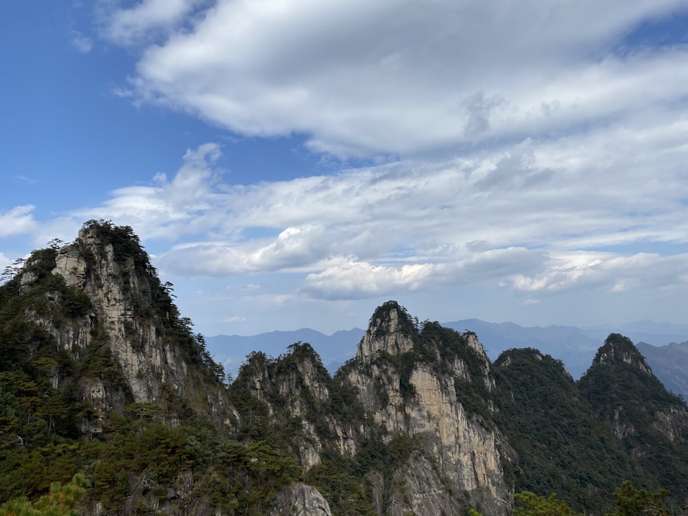 a view of a mountain range with mountains in the background