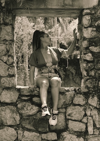 Ayesha enjoying a moment of reflection outdoors, embodying her adventurous spirit.