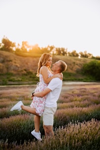 A joyful couple exchanging vows in a sunlit Provençal garden surrounded by lavender fields.