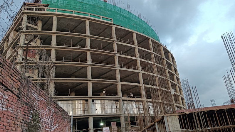A school building wrapped in scaffolding during a major capital improvement and renovation project