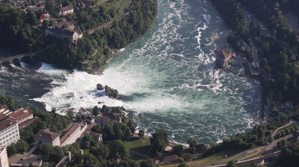 an aerial view of a river running through a city