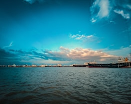 A fleet of cargo ships ready for international shipping.