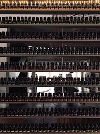 Bottles and containers filled with various industrial chemicals neatly arranged on shelves.