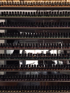 Bottles and containers filled with various industrial chemicals neatly arranged on shelves.