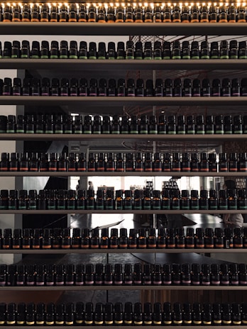 Shelves filled with neatly organized medicine bottles in a clean storage room.