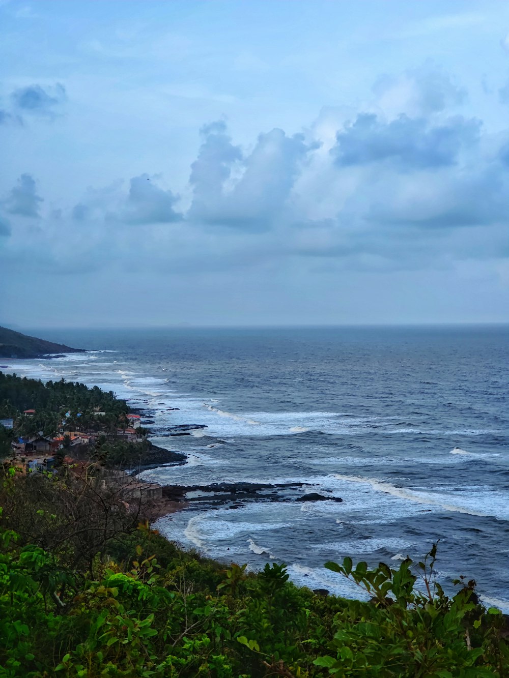 a view of the ocean from a hill