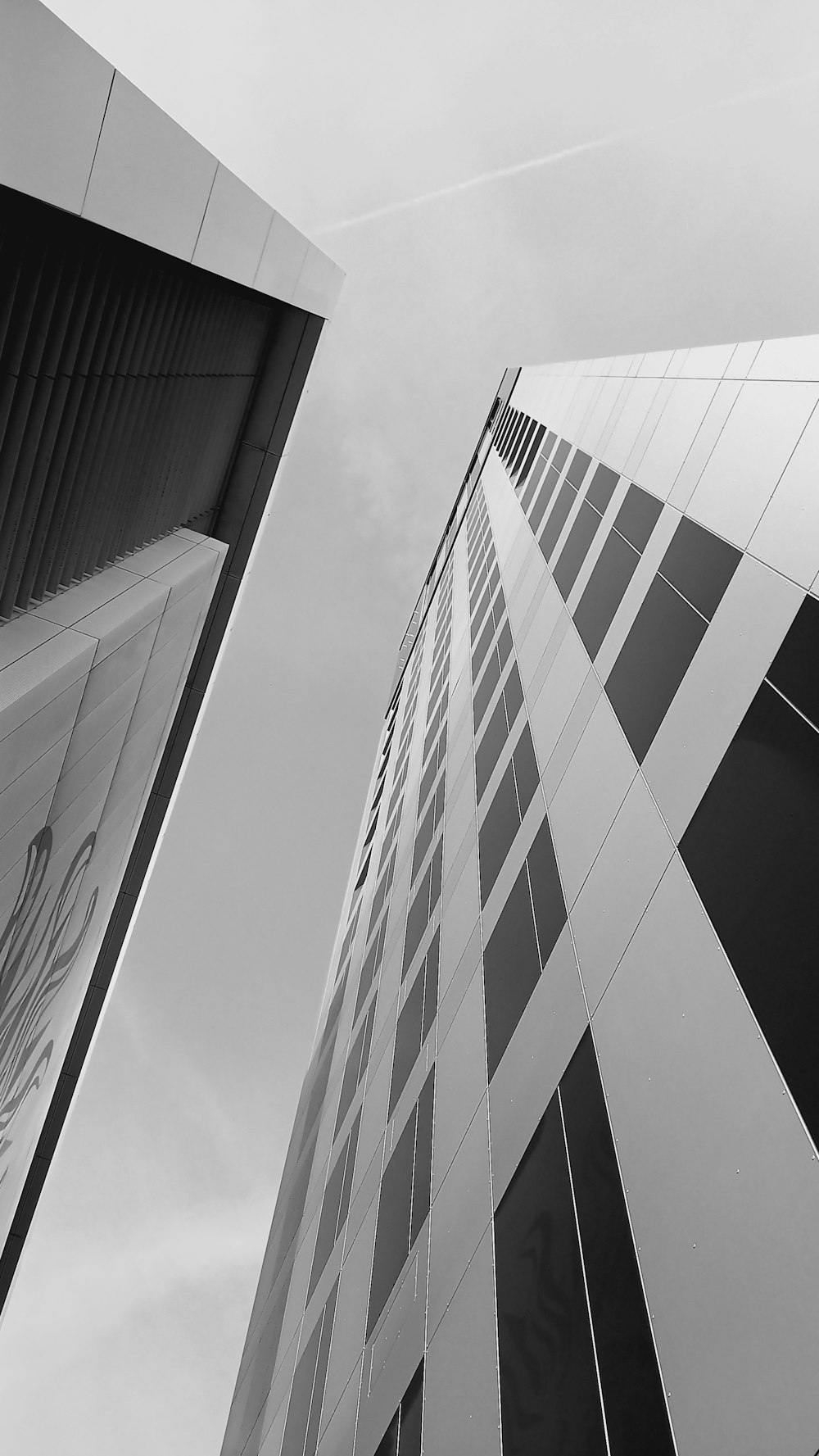 a black and white photo of a tall building