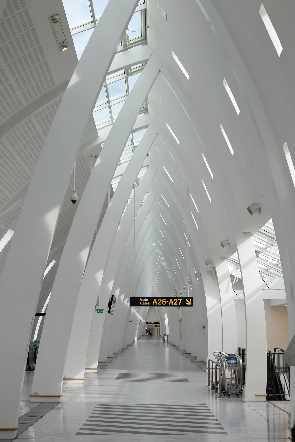 Sweeping glass and steel interior of a modern airport terminal