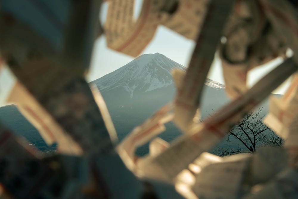 a view of a mountain through a mirror