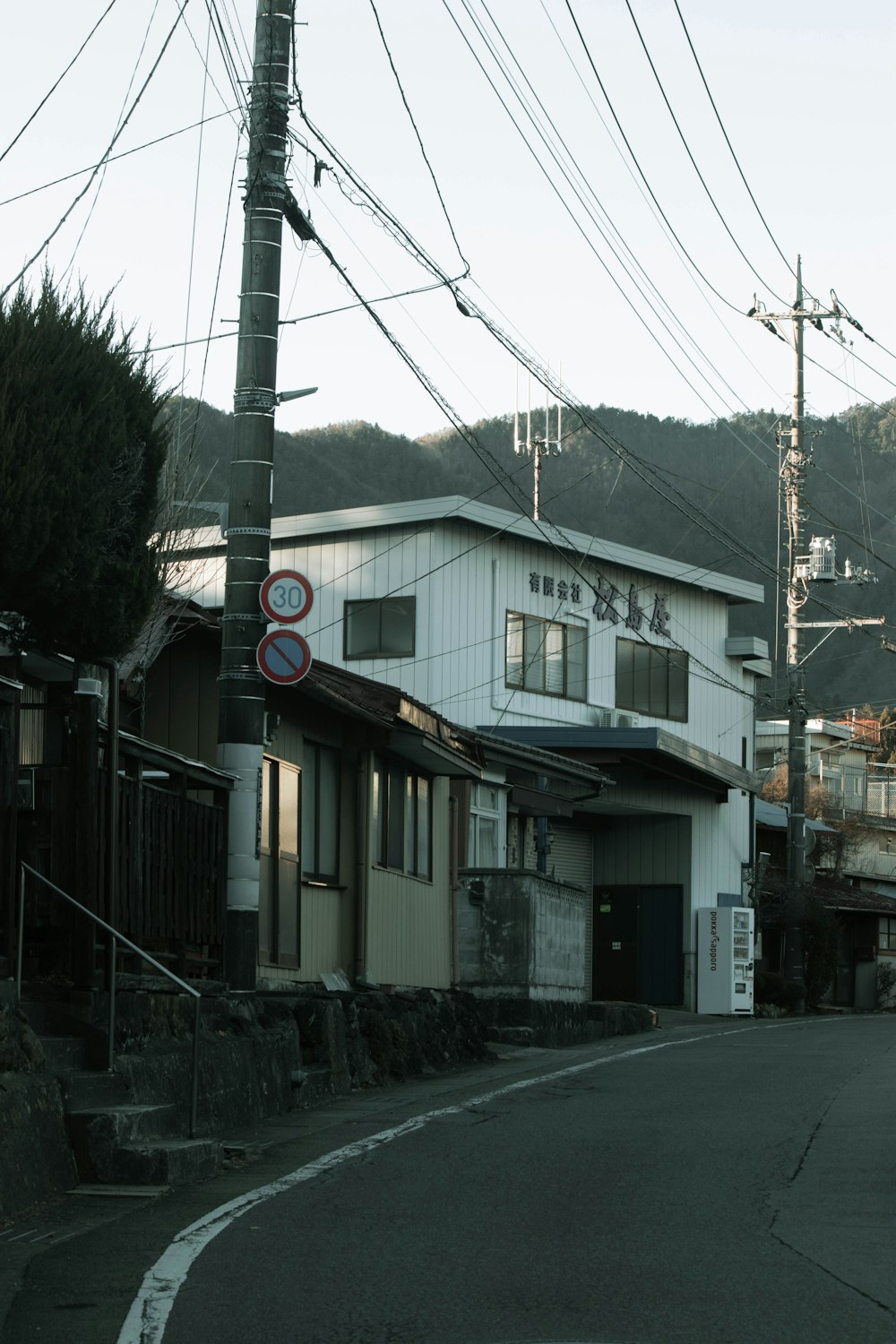 a street corner with a stop sign in front of a building